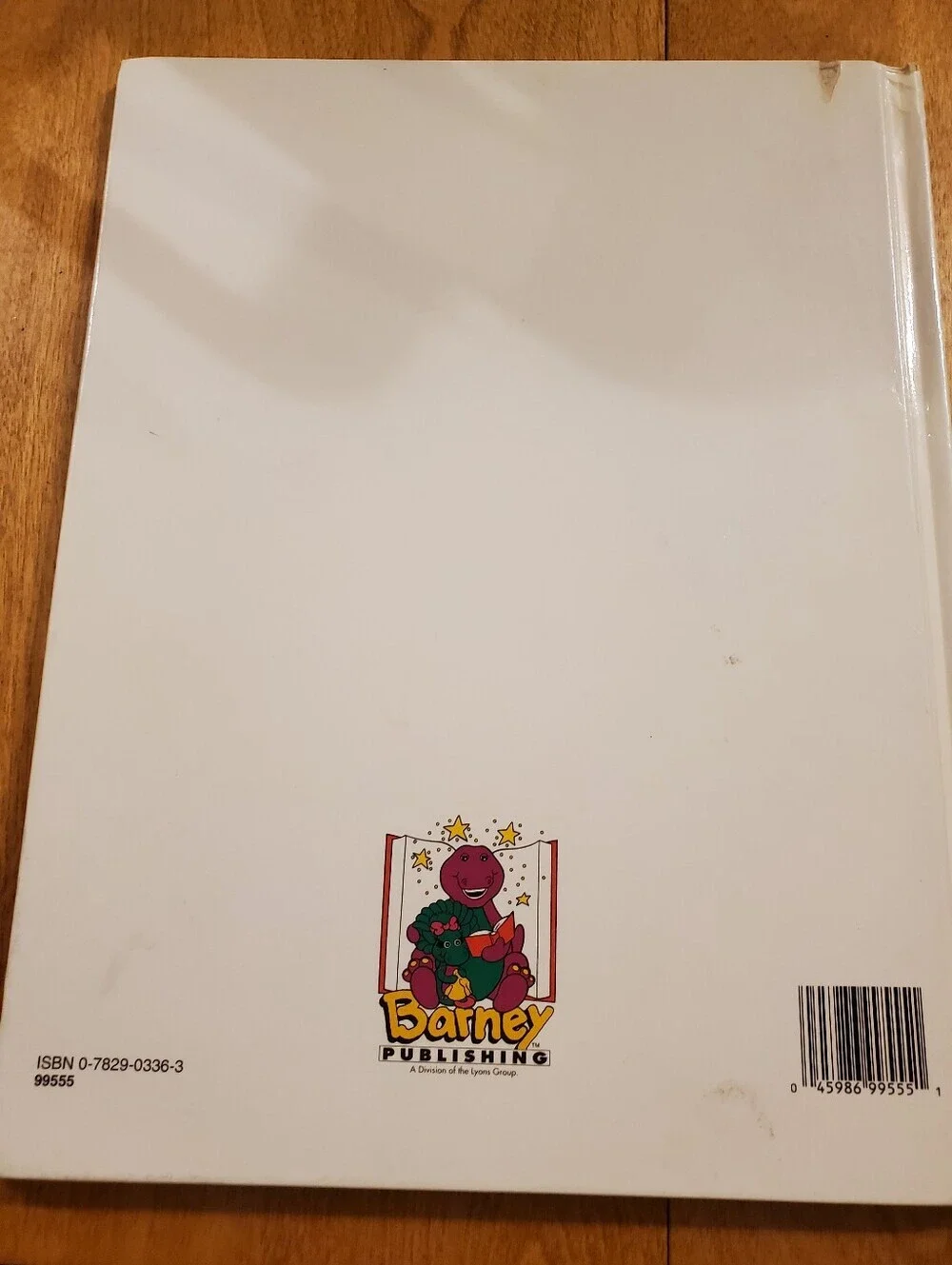 Barneys New York White Book Back Cover with Purple Barney Illustration